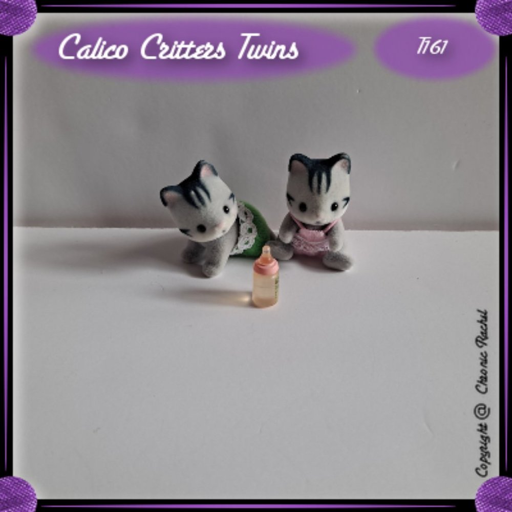 Fisher Cat Twins With Baby Bottle